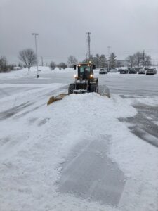 Town & Country Commercial Property Maintenance Plowing a commercial parking lot