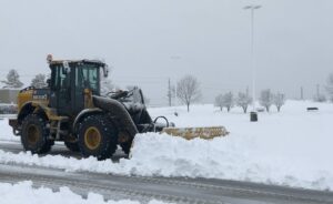 Town & Country Commercial Property Maintenance Plowing a commercial parking lot